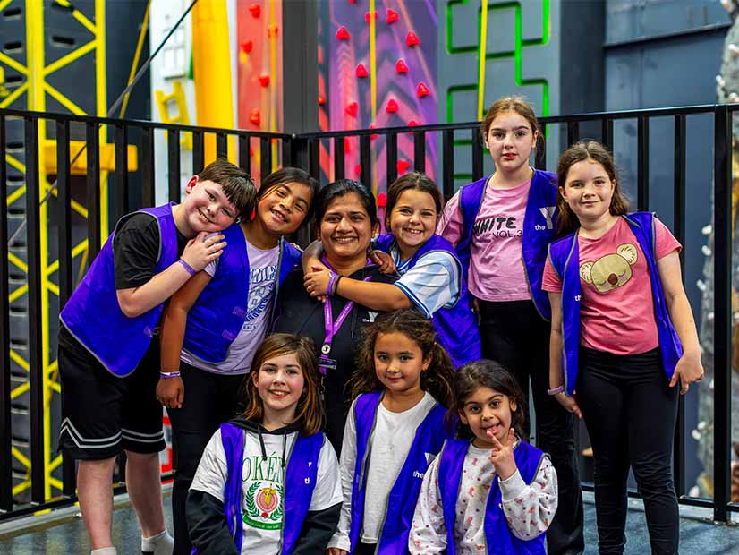 Educator and children at a rock climbing excursion
